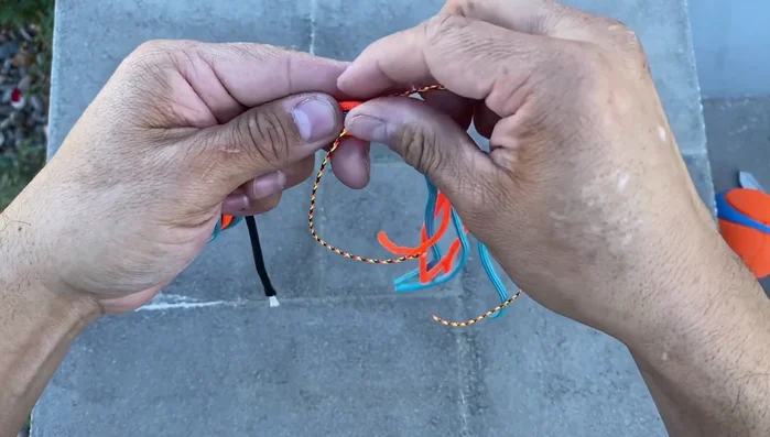 Secure the core: Wrap the bundled cords tightly with micro 90 cord at least three times. Secure the end by slipping it through the wrap and tightening.