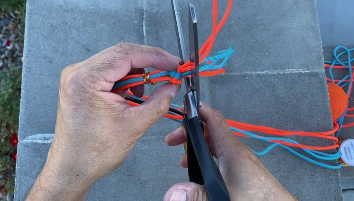 Prepare for attachment: Trim excess cord, leaving about 3/8 inch. Melt the ends together to form a bead.