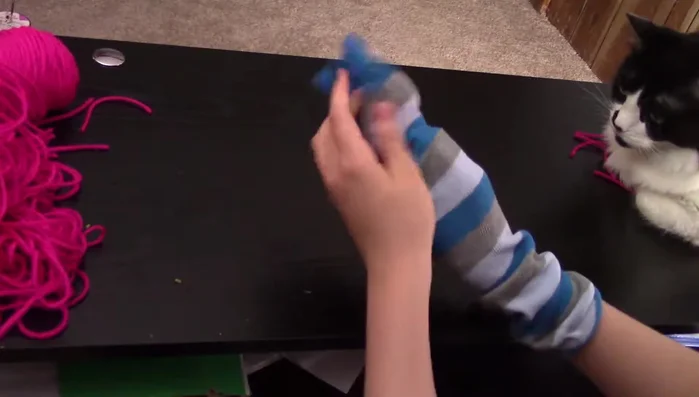 Stuff the toe area (if using a toe sock) with yarn/cloth.