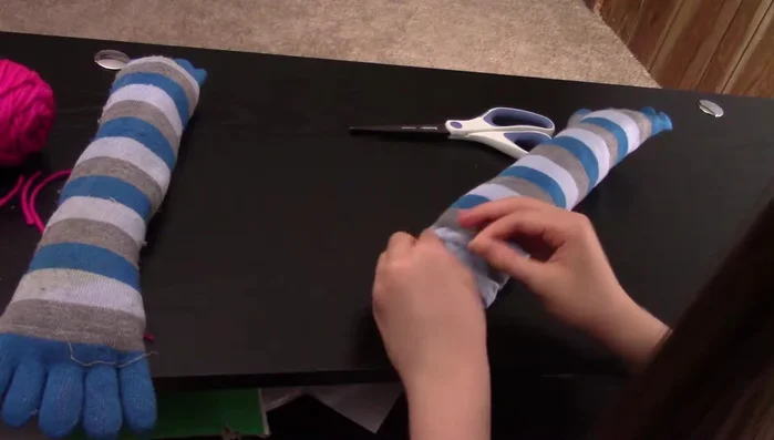 Tie off the thread securely.