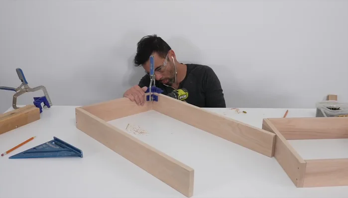 Create and attach the U-shaped vertical support using field measurements and clamps for precise fitting.