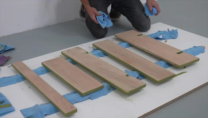 Lightly sand any stain that seeped to unwanted areas. Apply stain to the other side, let dry 2-3 hours.