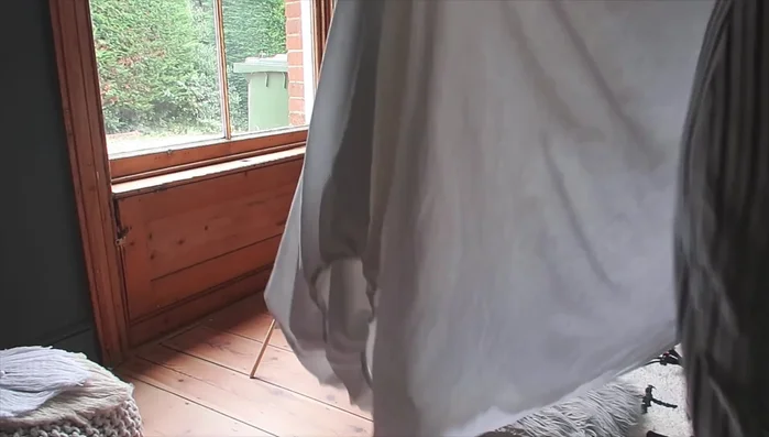 Secure fabric: Apply hot glue to the wooden dowels and press the fabric firmly to secure it. Repeat for all dowels.