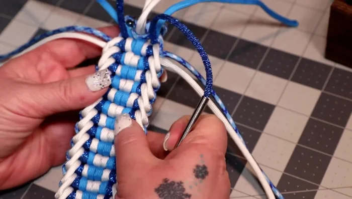 Cut and melt the ends of the cords, creating a clean finish. Use a lighter to melt the ends and press them down.