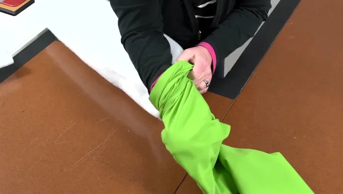 Close the open end of the tube by folding and sewing.