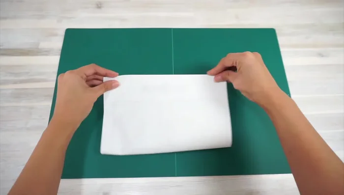 Stuff the ends with fabric scraps, add crinkle material, and sew the opening shut using a ladder stitch.