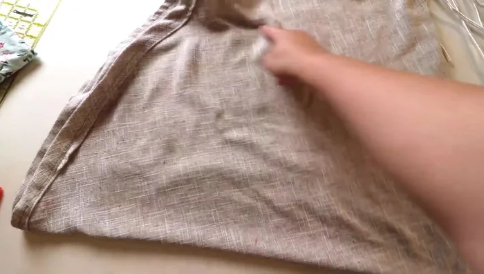 Cut two circles for the dog bed base. Measure and mark a half-circle on folded fabric, then cut.