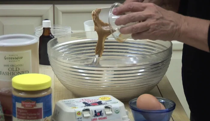 Add wet ingredients: ⅓ cup organic peanut butter, ¼ cup vegetable oil, ¼ cup organic applesauce, 2 organic eggs.