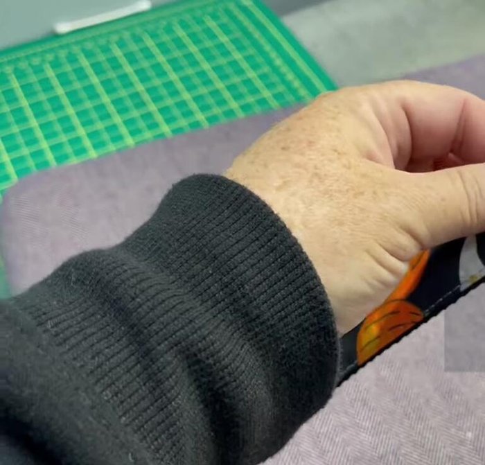 Attach strap slider: Thread one end of the webbing through the strap slider and fold over, creating a box shape. Sew to secure.