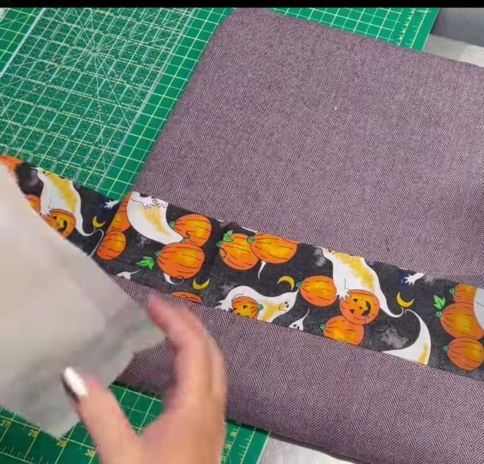 Fuse interfacing: Iron interfacing onto the wrong side of the fabric, leaving a 1-inch border on each end.