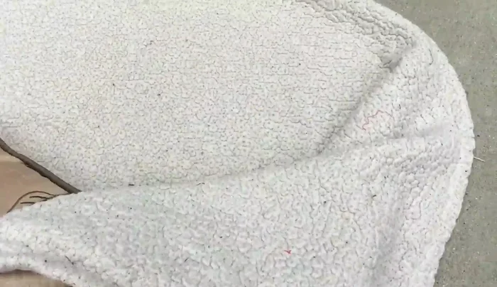 Wrap the blanket around the pillow like a burrito.