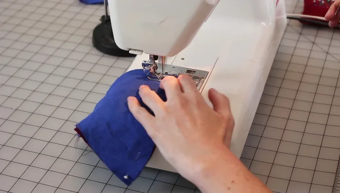 Hand sew ears onto the hood, matching placement lines.