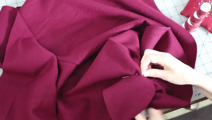 Hand sew ears onto the hood, matching placement lines.