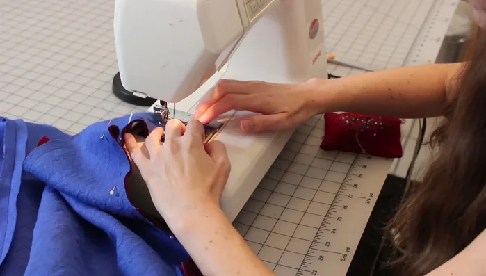 Sew outer and lining fabrics together, leaving a small opening for turning. Clip curves, turn right side out, and slip stitch opening closed.