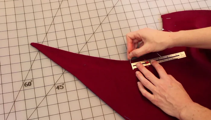 Mark and sew buttonholes along the front edge. Attach buttons.