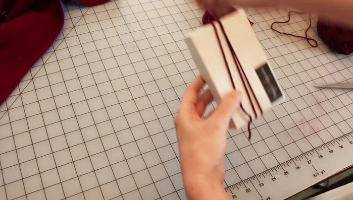 Make tassels (or use pre-made ones) and attach to hood points.