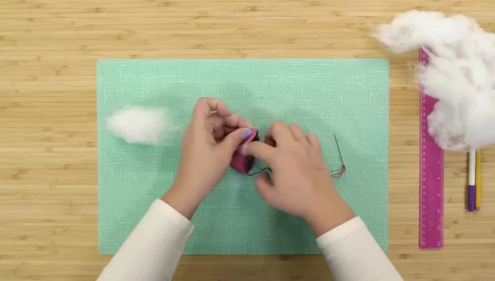 Stuff the mouse with pillow stuffing until full.