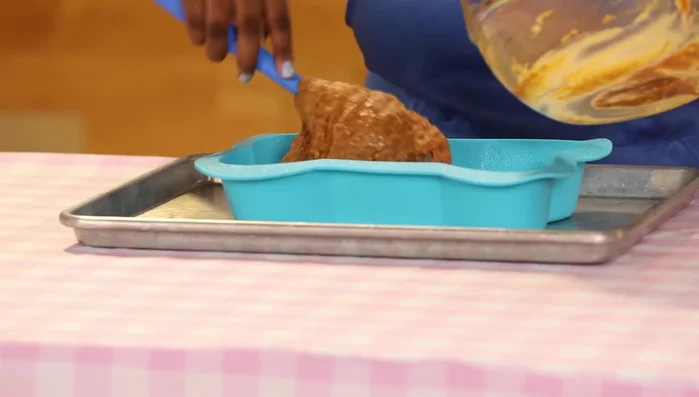 Pour batter into a greased dog-shaped cake pan and bake at 350°F for 20-25 minutes.