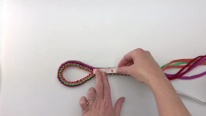 Tie off the end with a secure knot, trim excess material.