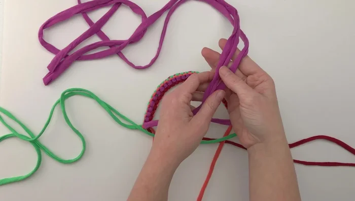 Continue knotting until you reach the desired length for the toy's body (around 6.25 inches).