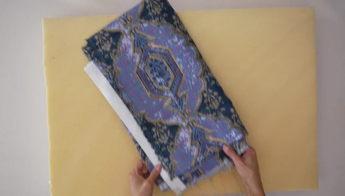 Cut fabric for back piece: length of side + 1 inch, height + 2 inches. Fold in half lengthwise and cut to create two narrow pieces.