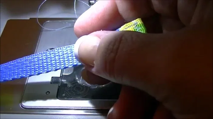 Slide the free end through the remaining end of the buckle.