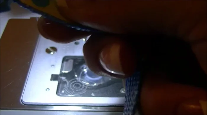 Slide the free end through the remaining end of the buckle.