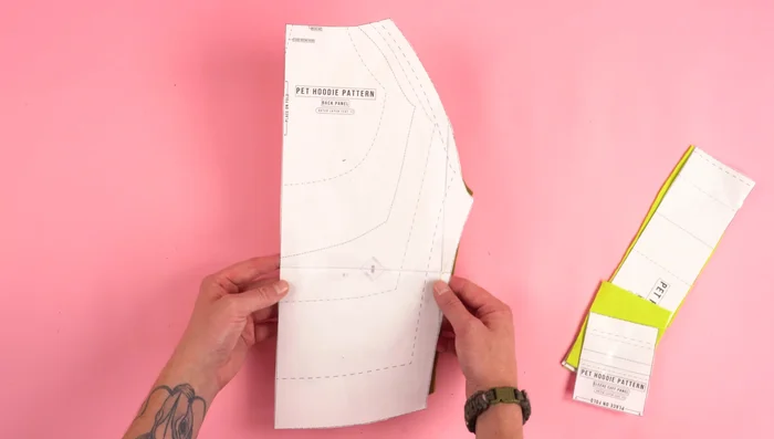 Cut the Fabric: Cut out the pattern pieces from sweatshirt fleece and rib knit fabric.