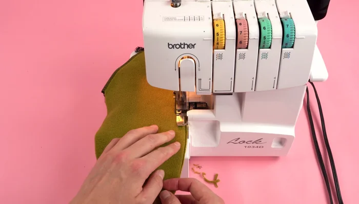 Attach Pockets: Sew the pocket panels together, leaving the top open. Position and attach the pockets to the back panel.