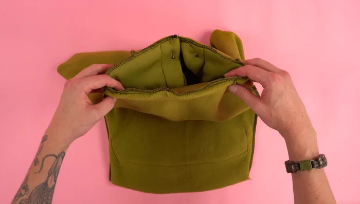 Attach Hood: Attach the hood to the neckline, aligning the center seams. Add top stitching.