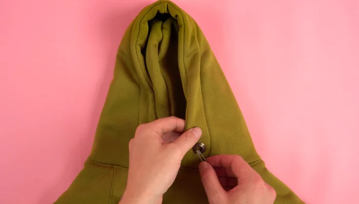 Add Drawstring (Optional): Thread a cord through the eyelets and add cord stoppers.