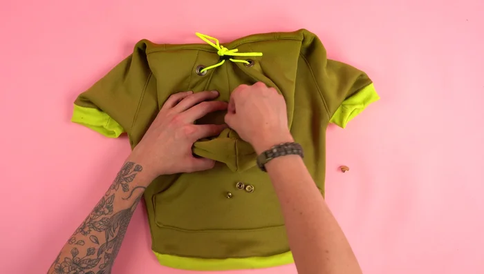 Attach Snap Button: Attach a snap button to the hood to keep it closed.