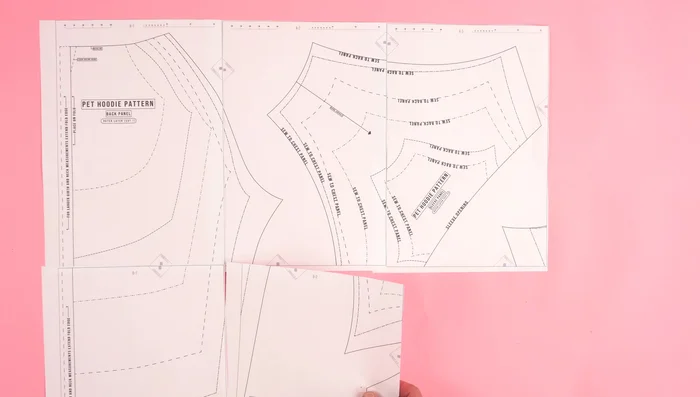 Prepare the Pattern: Print and assemble the pattern, adjusting sizes as needed by extending the fold or bottom edge lines to fit your pet's measurements.