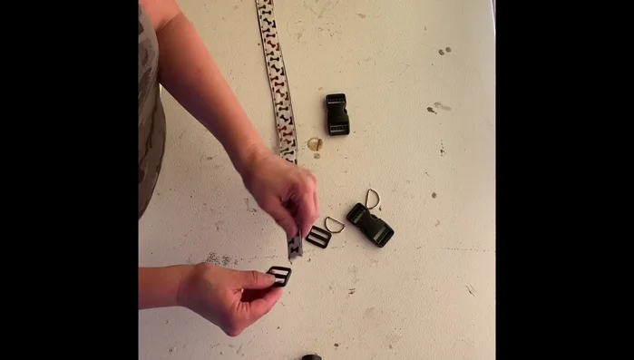 Stitch the D-ring to the collar, reinforcing it as well.