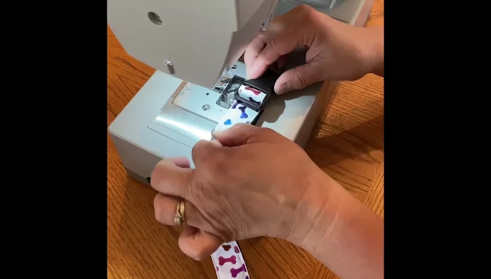 Stitch along the side of the clasp, reinforcing it by stitching back and forth multiple times.