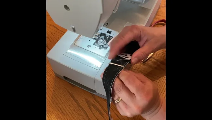 Stitch the D-ring to the collar, reinforcing it as well.