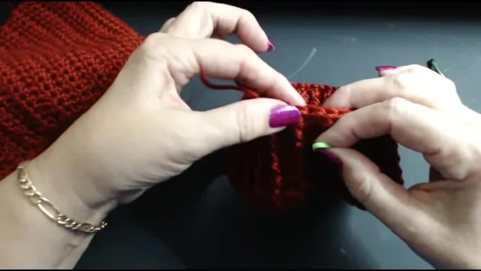 In the last row, mark 6 stitches for the ear hole on each side. This is crucial for proper ear placement.