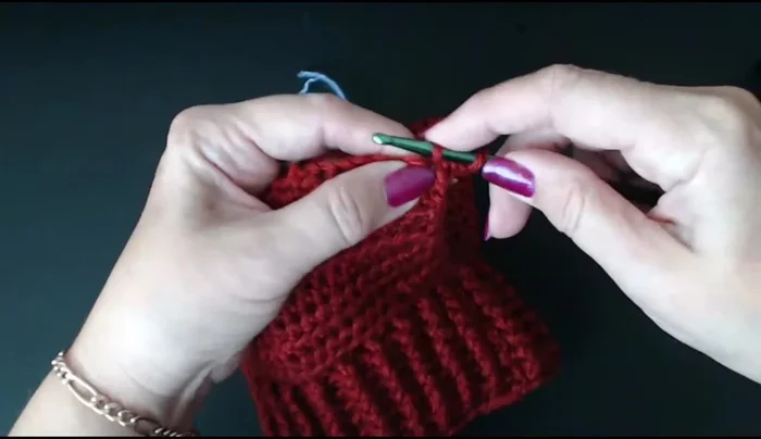Create the ear holes by chaining 2 stitches and working a series of double crochets around the marked stitches.
