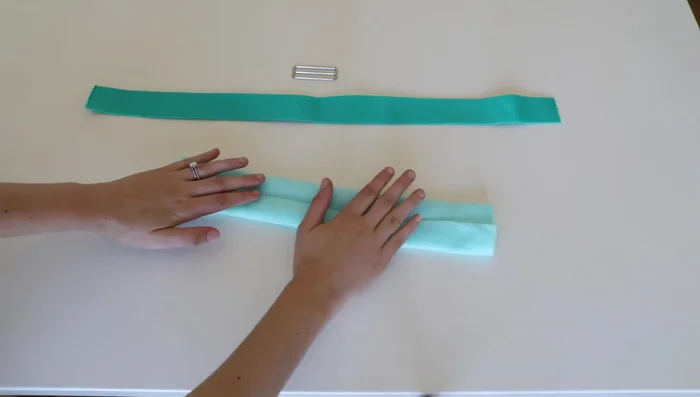 Attach tri-glide to the other end (3-inch end) of the chest strap; reinforce with stitches.