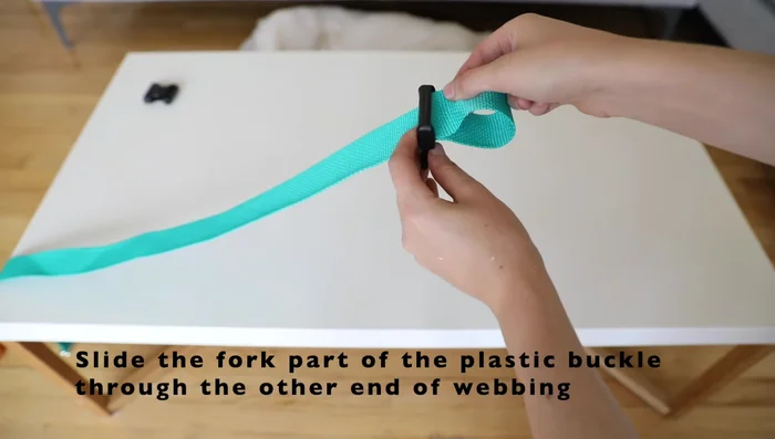 Sew on the plastic buckle for the back strap.