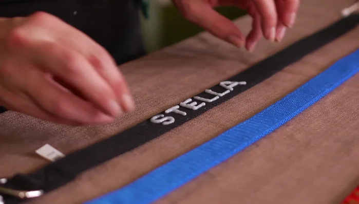 Create small circles with rhinestones around the name for a framed effect.