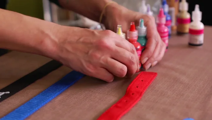 Create small circles with rhinestones around the name for a framed effect.