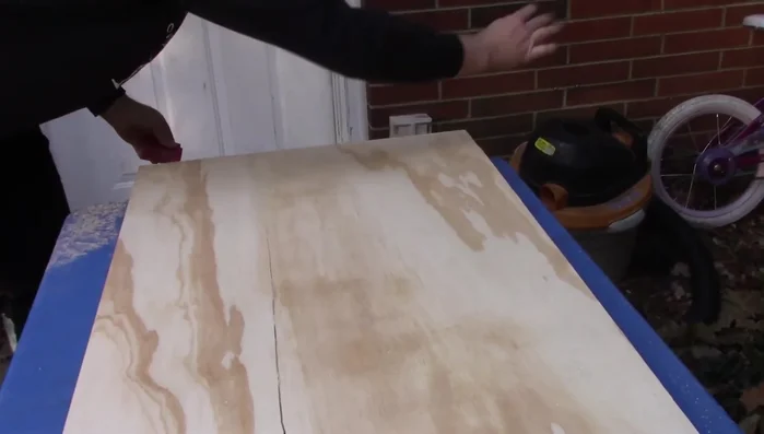 Sand the edges of the plywood for smoothness.