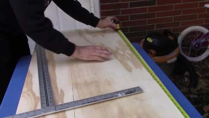 Sand the edges of the plywood for smoothness.
