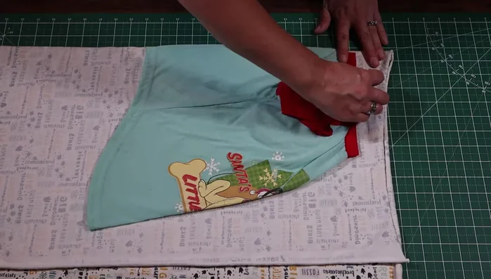Cut out the shirt pieces: Cut out the main body of the shirt, remembering seam allowances. Create the armholes using your finger as a guide, add seam allowance, and cut.