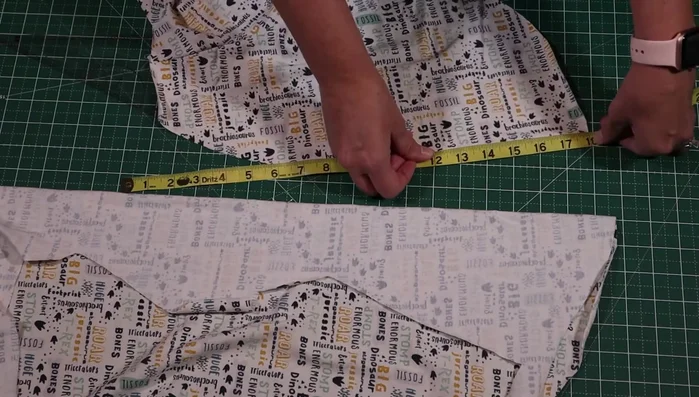 Attach the spikes: Attach the filled spikes to the back panel, making sure they stand up straight. Sew together, securing the spikes and the layers.