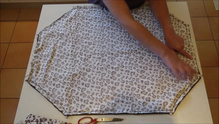 Turn and stuff: Turn the fabric right side out and stuff it with filling material until it is firm and resembles the shape of a cat cap.