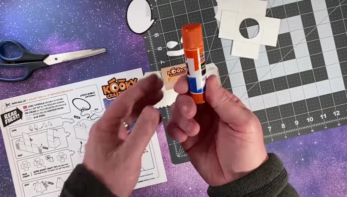 Fold and glue the ears onto the head.