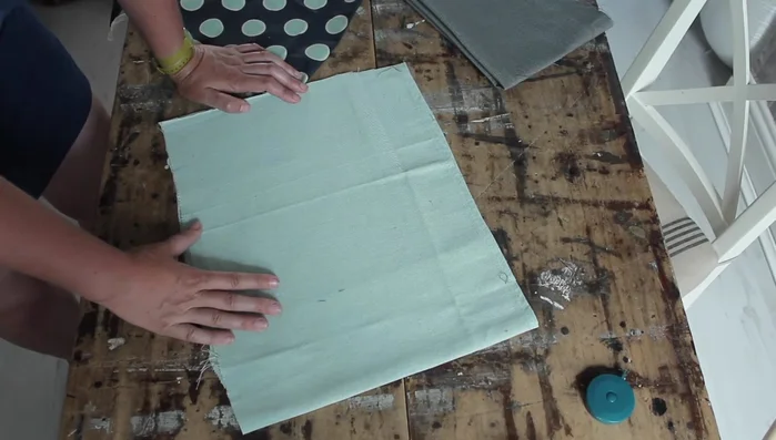 Cut fabric pieces: Base (40cm x 30cm sturdy fabric), two cushion pieces (40cm x 30cm cotton), and side piece (130cm x 40cm, calculated based on length + seam allowances).