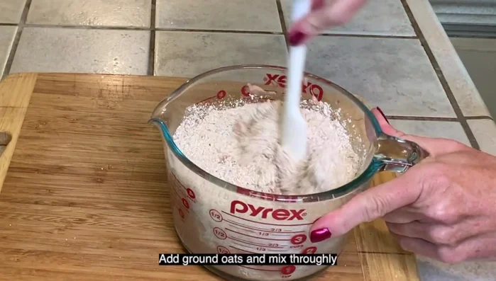 Add ground oats and mix thoroughly until a ball forms.